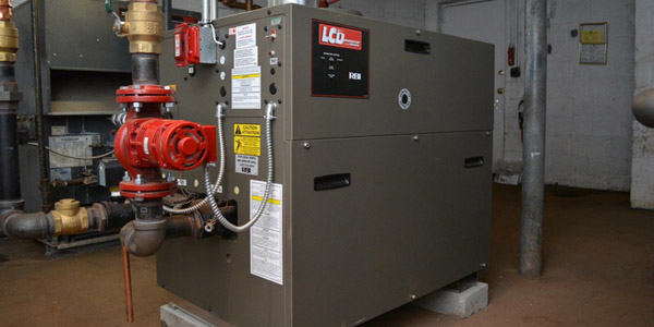 Commercial boiler installation in a Long Island building mechanical room