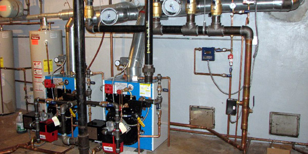 Cast iron steam boiler installed in a Long Island home basement